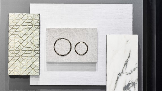 Die Geberit Sigma21 Betätigungsplatte in Betonoptik und verchromten Designringen Die Geberit Sigma21 Betätigungsplatte in Betonoptik und verchromten Designringen